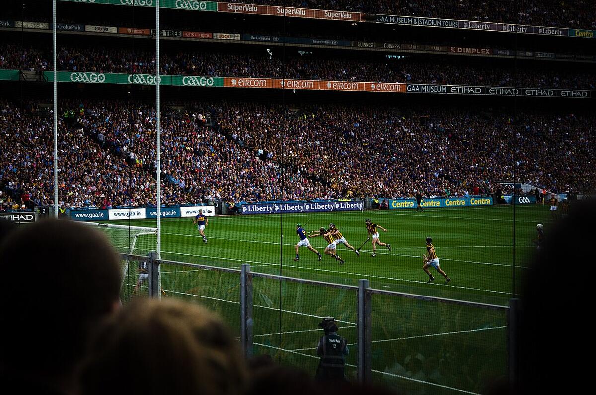 A hurling match in a full stadium